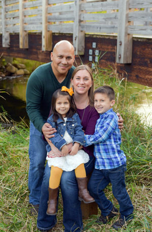 George Diaz poses with his family: daughter, Nora; wife, Heather; and son, Sam.