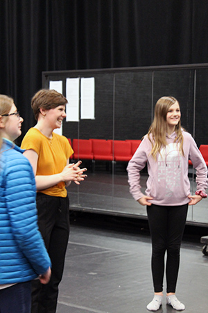 Ahnika Lexvold provides instruction to Winona area students Lillian Bublitz and Anastasia Shutz.